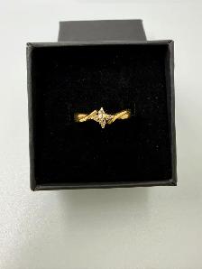 We are selling a10K Women's Ring With Small Diamond Chips~Size 6
