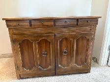 Singer sewing machine in cabinet with accessories