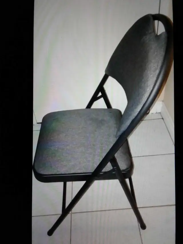 Sturdy folding metal chair with padded backrest & seat $15