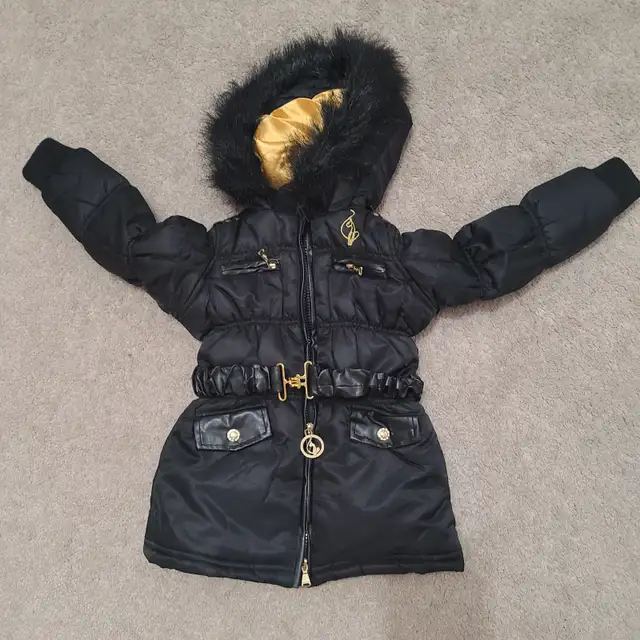 Stay warm and stylish this season with this Baby Phat Puffer Jac