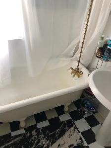 Clawfood  30x60 tub with a plumbing and the rod