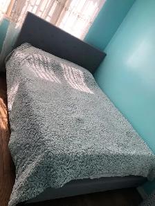 Queen bed for sale with a mattresses .