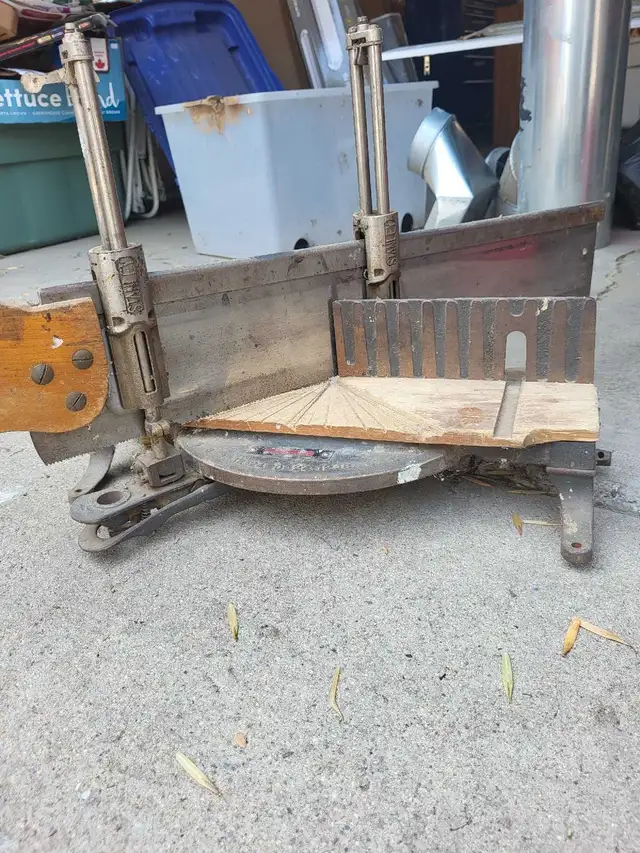 vintage hand saw and stand