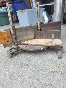 vintage hand saw and stand