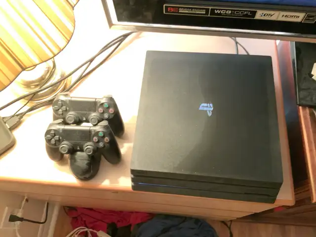 Sony PlayStation 4 Pro 1TB with 2 controller price to go