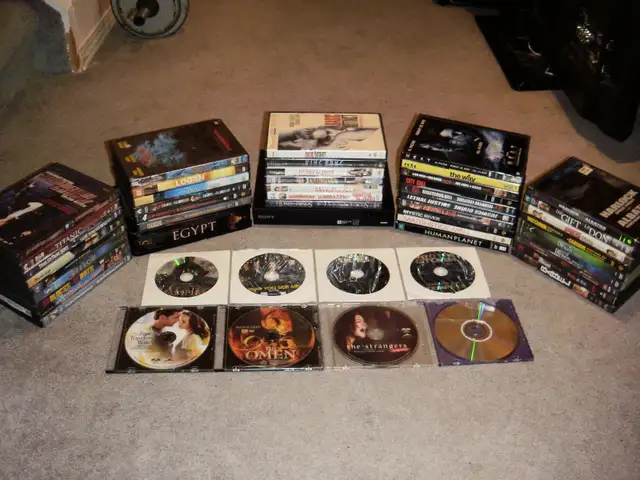 BLU-RAY PLAYER   57 DVD MOVIES, $70.