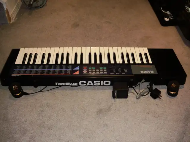 JAPANESE-MADE SYNTHESIZER, $130.