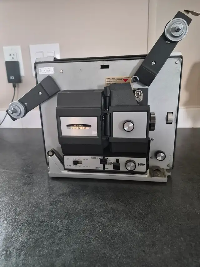 BELL and HOWELL MOVIE PROJECTOR  $100 O.B.O.