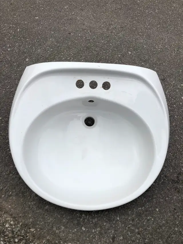 White ceramic sink basin of this style and size (approximately 2