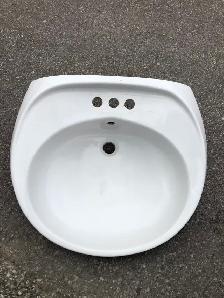 White ceramic sink basin of this style and size (approximately 2