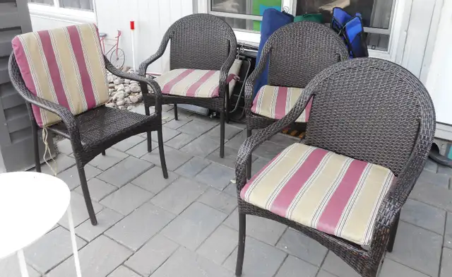 4 Rattan chair with cushions excellent condition they stacked up