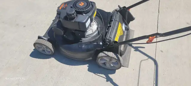 Remington push mower like new $250.00