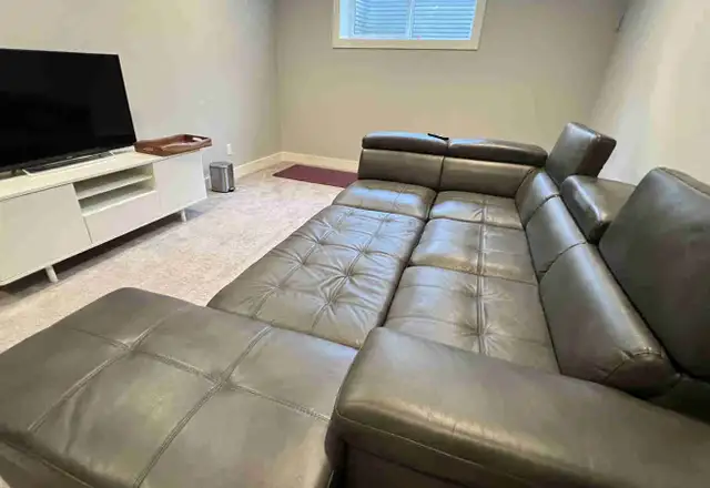 Faux leather sofa set with pull out bed and ottoman