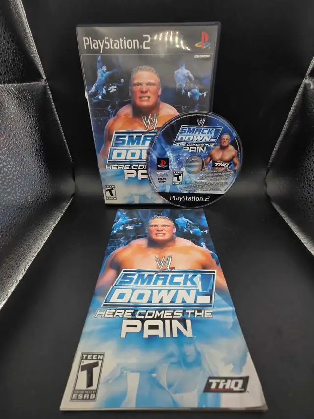 PS2 WWE SMACKDOWN HERE COMES THE PAIN W/MANUAL