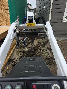 excavations and bobcat - Photo 2