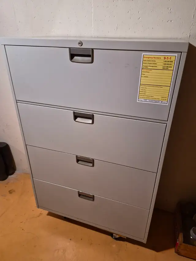 Filing cabinet with wide pull out drawers
