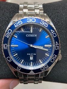 Brand new men’s Citizen Eco Drive blue dial 42 mm. $300.