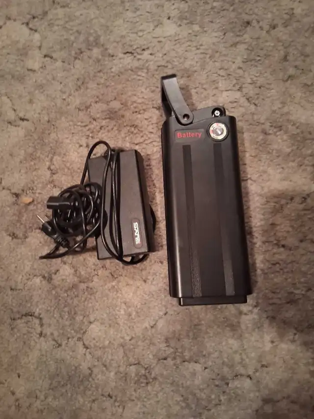 Daymac 48V battery. New. with charger cables and keys