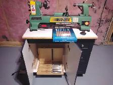 Wood lathe with cabinet
