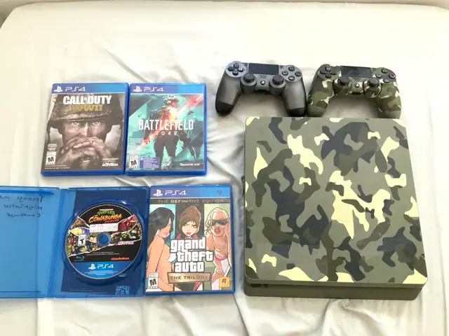 Sony PlayStation 4 1TB with 2 controllers, 15 games