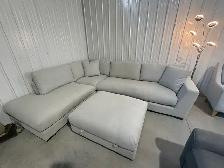Large grey fabric sectional with ottoman