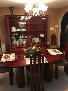 kitchen or dining room table with chairs and hutch