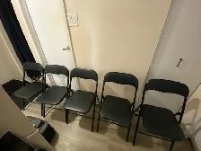 For Sale 5 used black folding chairs