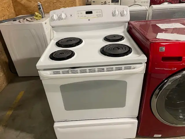 Cuisinière blanche ronds serpentins GE