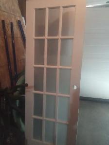 Interior door with glass