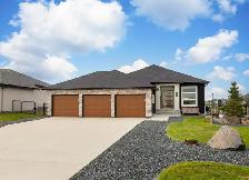 Stunning 4bdrm Bungalow w/Triple Att Garage on a Prime Lake Lot!