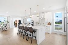 Stunning 4bdrm Bungalow w/Triple Att Garage on a Prime Lake Lot! - Photo 2