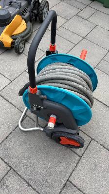 Portable garden hose reel with 100 feet heavy duty garden hose
