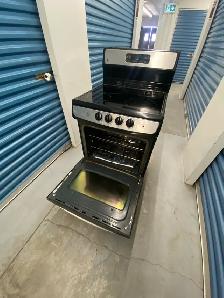 GE STAINLESS STEEL ELECTRIC STOVE - Photo 6