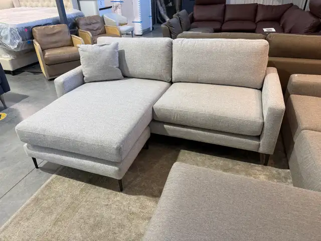 Grey fabric sectional with reversible chaise