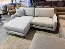 Grey fabric sectional with reversible chaise