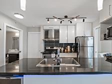 Modern and Spacious 2 Bedroom plus Den Condo Suite - Photo 2