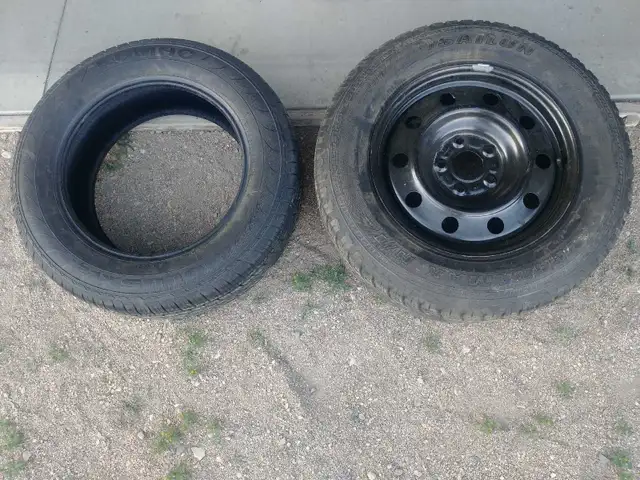 One 225/65R17 tire and one 245/65R17 tire with rim