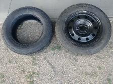 One 225/65R17 tire and one 245/65R17 tire with rim