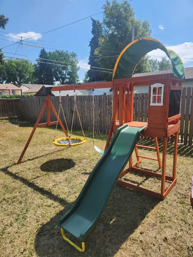 beautiful wooden swing set.