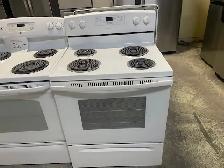 Cuisinière blanche ronds serpentins Amana
