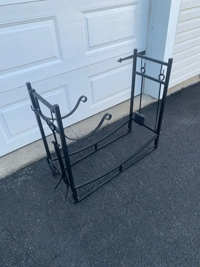large firewood rack with tools and kindling holder