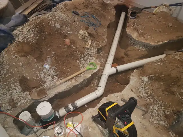 DRAIN REPAIR SUMP PUMP ISSUE WATERPROOFING ROUGH IN WASHROOM WET