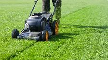 Father and Daughter grass cutting
