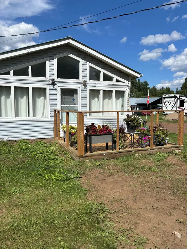 Country 2 bedroom home with beautiful sunroom for rent.