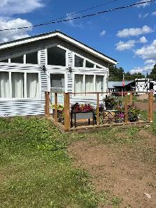 Country 2 bedroom home with beautiful sunroom for rent.