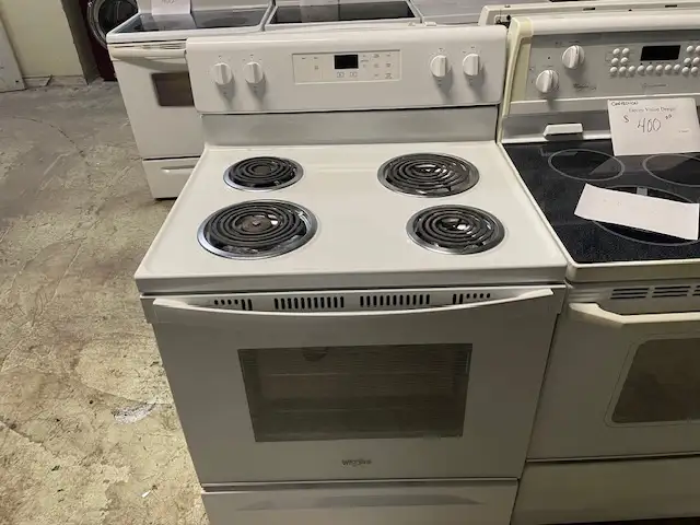 Cuisinière blanche ronds serpentins Whirlpool
