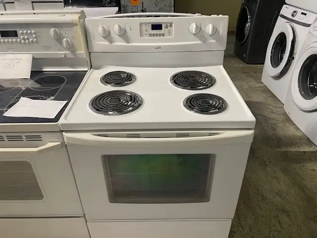 Cuisinière blanche ronds serpentins Whirlpool