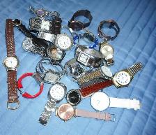 4 bags of 25 watches each bag all different brands all working