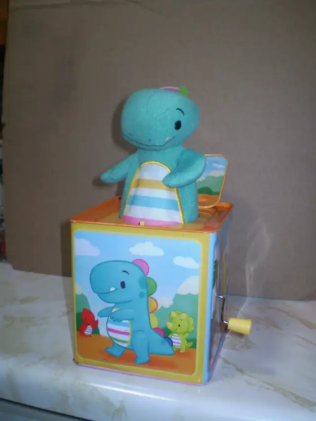 Baby Dino Jack-in-the Box- used-works-$15