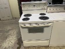 Cuisinière blanche ronds serpentins GE